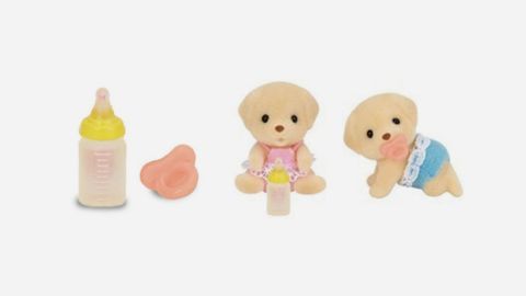 Recalled bottle in yellow and recalled pacifier in pink