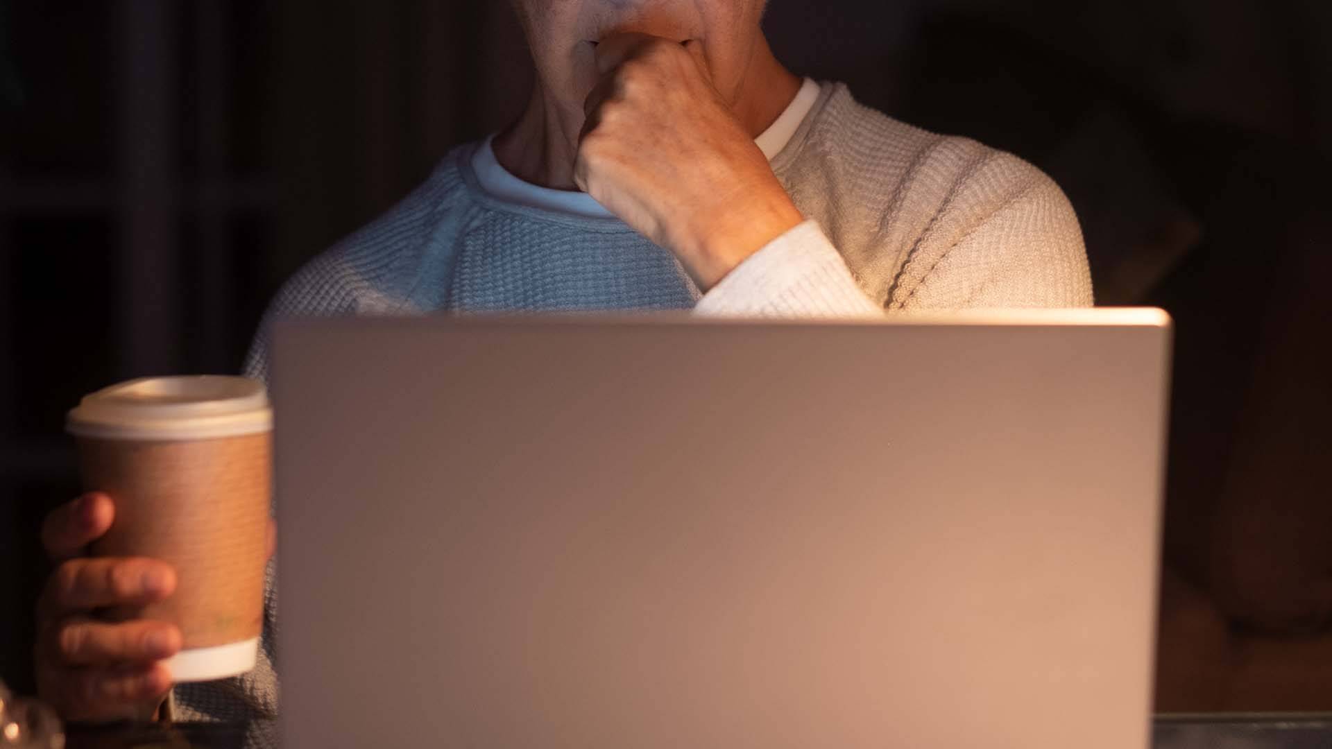 Close up photo of a woman searching for a lawyer online