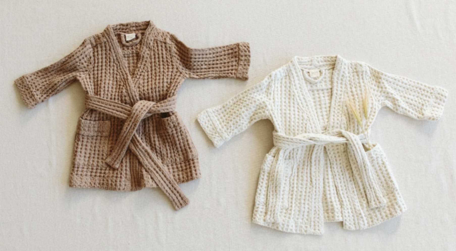 Recalled Goumi children’s robes in natural and alabaster color