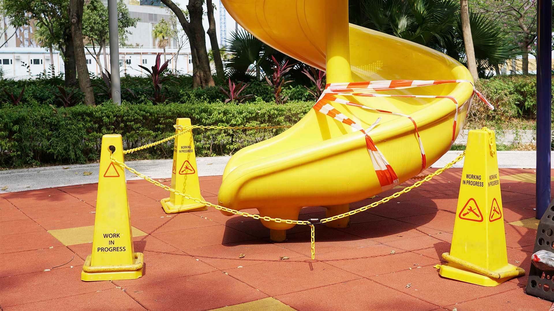 A dangerous playground with a defective slide or jungle gim