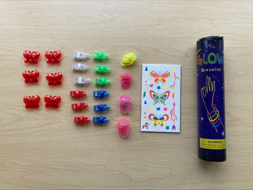 Recalled SNLN Party Supply Toys with Butterfly Clips, Mini Flashlights, Light-Up Ring, Sticker Book and 100-Piece Glow Bracelets